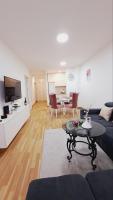 a living room with a couch and a table at Maja 2 in Ruma