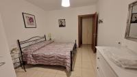 Posteľ alebo postele v izbe v ubytovaní White Apartment