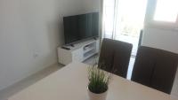 Televízia a/alebo spoločenská miestnosť v ubytovaní Apartments ITD