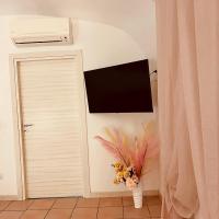 Televízia a/alebo spoločenská miestnosť v ubytovaní Aurora's Home