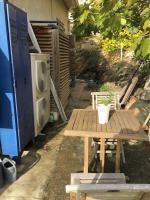 a picnic table and a tv in a backyard at FLC-Sea View-Jacuzzi-3 Bedrooms-8p-Parking for 2 cars in Marseille