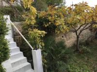 a set of stairs in a garden with a tree at FLC-Sea View-Jacuzzi-3 Bedrooms-8p-Parking for 2 cars in Marseille