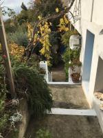 an entrance to a garden with flowers and plants at FLC-Sea View-Jacuzzi-3 Bedrooms-8p-Parking for 2 cars in Marseille