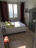a bedroom with a large white bed and a window at FLC-Sea View-Jacuzzi-3 Bedrooms-8p-Parking for 2 cars in Marseille