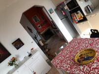 a room with a kitchen with a table with a bed at FLC-Sea View-Jacuzzi-3 Bedrooms-8p-Parking for 2 cars in Marseille