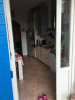 a kitchen with pink shoes on the floor in a room at FLC-Sea View-Jacuzzi-3 Bedrooms-8p-Parking for 2 cars in Marseille