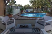 The swimming pool at or close to Star Jasmine House Acharavi