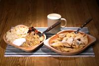 a table with two bowls of food and a cup of coffee at Hotel-EuroPenzión Salaš in Vinné