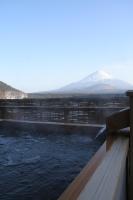 a water dam with a mountain in the background at Yamadaya Hotel in Fujikawaguchiko