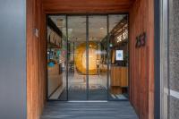 an entrance to a store with a large glass door at CHECK inn Taipei Songjiang in Taipei