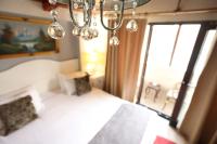 A bed or beds in a room at Asmali Hotel