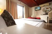 A bed or beds in a room at Asmali Hotel