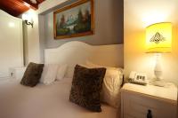 A bed or beds in a room at Asmali Hotel