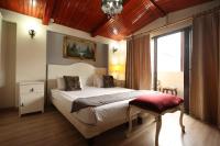 A bed or beds in a room at Asmali Hotel