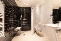 a bathroom with a toilet and a sink and a shower at Holiday Inn Express Amiens, an IHG Hotel in Amiens