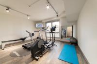 a gym with treadmills and exercise equipment in a room at Holiday Inn Express Amiens, an IHG Hotel in Amiens