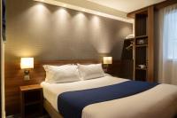 a bedroom with a large bed in a room at Holiday Inn Express Amiens, an IHG Hotel in Amiens