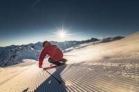 a person is skiing down a snow covered slope at Pension Weinberger in Obertauern