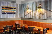 ein Restaurant mit Holztischen und Stühlen in einem Raum in der Unterkunft Loch Rannoch Hotel and Spa in Kinloch Rannoch