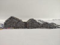 a large building in the snow with snow at Studio Plagne Aime 2000, 1 pièce, 4 personnes - FR-1-181-2618 in Aime-La Plagne