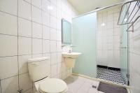 a bathroom with a toilet and a sink and a shower at Jamie home stay in Taitung City