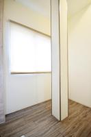 a sliding door in an empty room with a wooden floor at Jamie home stay in Taitung City