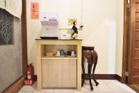 a kitchen with a table and a counter with a counter at Jamie home stay in Taitung City