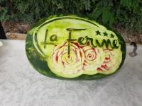 a water melon with the word ironic written on it at Logis Hotel Restaurant la Ferme in Avignon