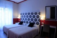 Postel nebo postele na pokoji v ubytování Hostal Oriente