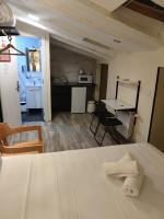A kitchen or kitchenette at Good Stay Rooms