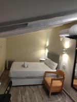 A bed or beds in a room at Good Stay Rooms