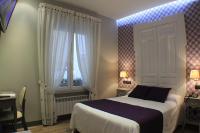 Postel nebo postele na pokoji v ubytování Hostal Oriente