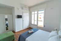 A bed or beds in a room at CapoSud - Suite Randa