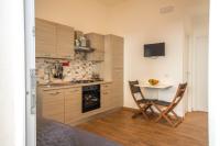 A kitchen or kitchenette at CapoSud - Suite Randa