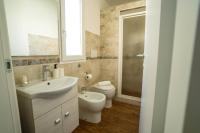 A bathroom at CapoSud - Suite Randa
