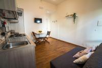 A kitchen or kitchenette at CapoSud - Suite Randa