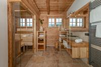 a bathroom with a glass shower and a sink at Almchalet Linharterhof in Haus im Ennstal
