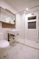 a bathroom with a toilet and a sink and a shower at Mixa Hostel in Hualien City