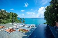 an aerial view of a resort with the ocean at Sri Panwa Phuket Luxury Pool Villa Hotel - SHA Plus in Panwa Beach