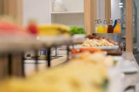 a buffet line with food and bottles of drinks at The Verandah - SHA Extra Plus in Ao Nang Beach