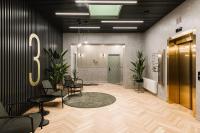 an office with chairs and a sign on the wall at Konventa Sēta Hotel Keystone Collection in Riga
