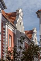 a building with a tower on the side of it at Konventa Sēta Hotel Keystone Collection in Riga