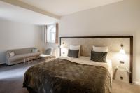 Postel nebo postele na pokoji v ubytování Ascot Hotel