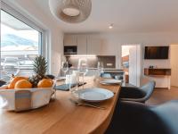 a dining room table with a bowl of fruit on it at Apartment Das Georgen- Schmitten by Interhome in Fürstau