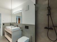 a bathroom with two sinks and a mirror at Apartment Das Georgen- Schmitten by Interhome in Fürstau