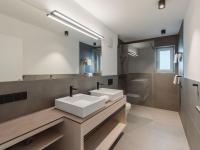 a bathroom with a sink and a toilet and a mirror at Apartment Das Georgen- Schmitten by Interhome in Fürstau