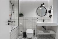 a bathroom with a sink and a toilet and a mirror at Konventa Sēta Hotel Keystone Collection in Riga