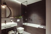 a bathroom with a sink and a toilet and a tub at Konventa Sēta Hotel Keystone Collection in Riga