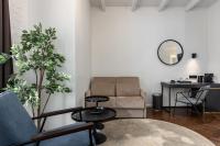 a living room with a couch and a table at Konventa Sēta Hotel Keystone Collection in Riga
