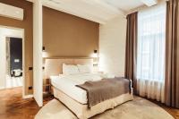a bedroom with a bed and a large window at Konventa Sēta Hotel Keystone Collection in Riga